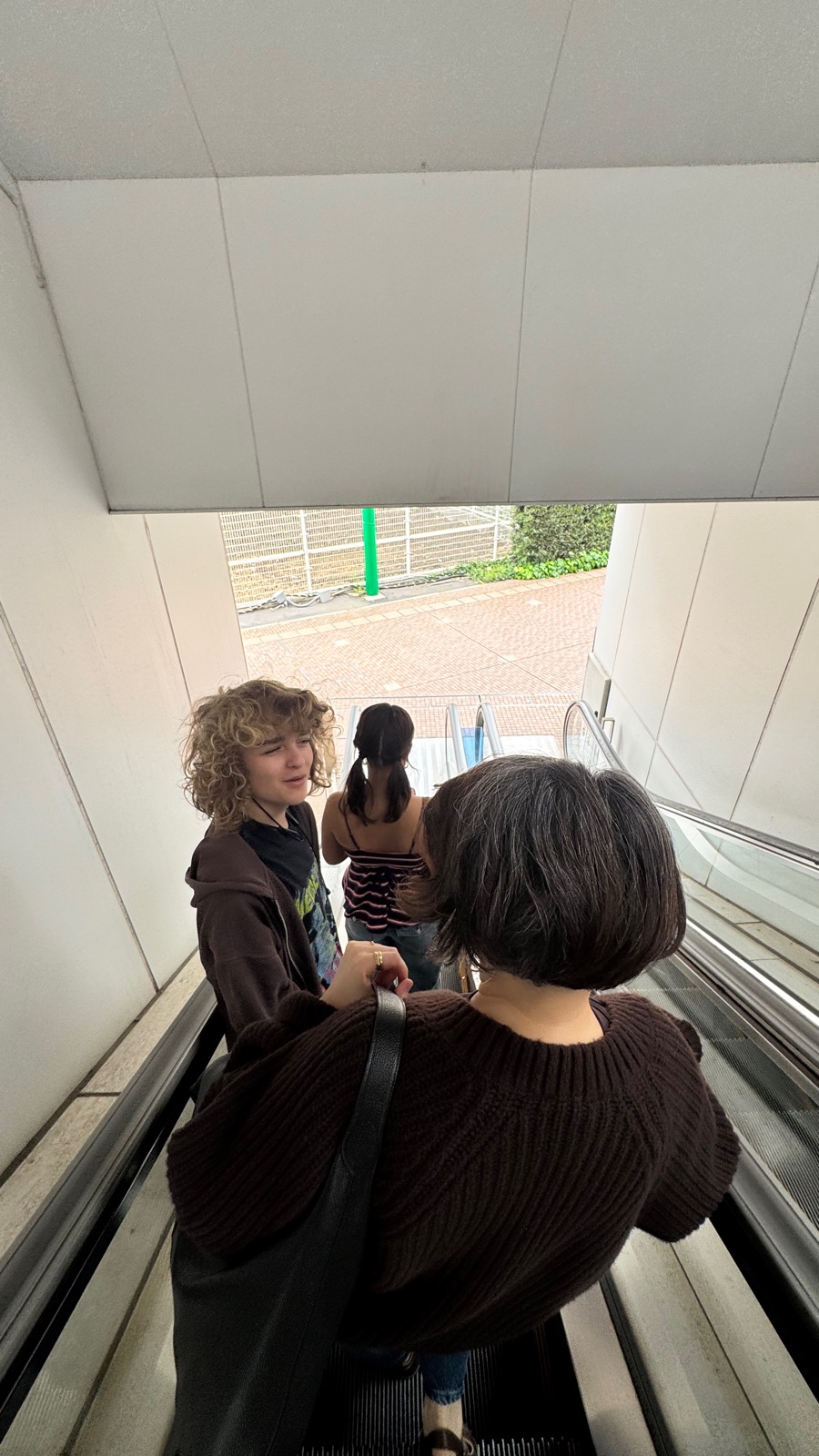 Family heading out on the escalator