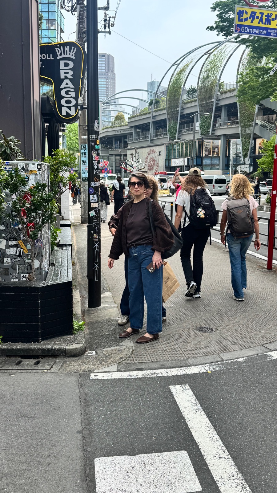 Natalia on the Shibuya streets with shopping bags
