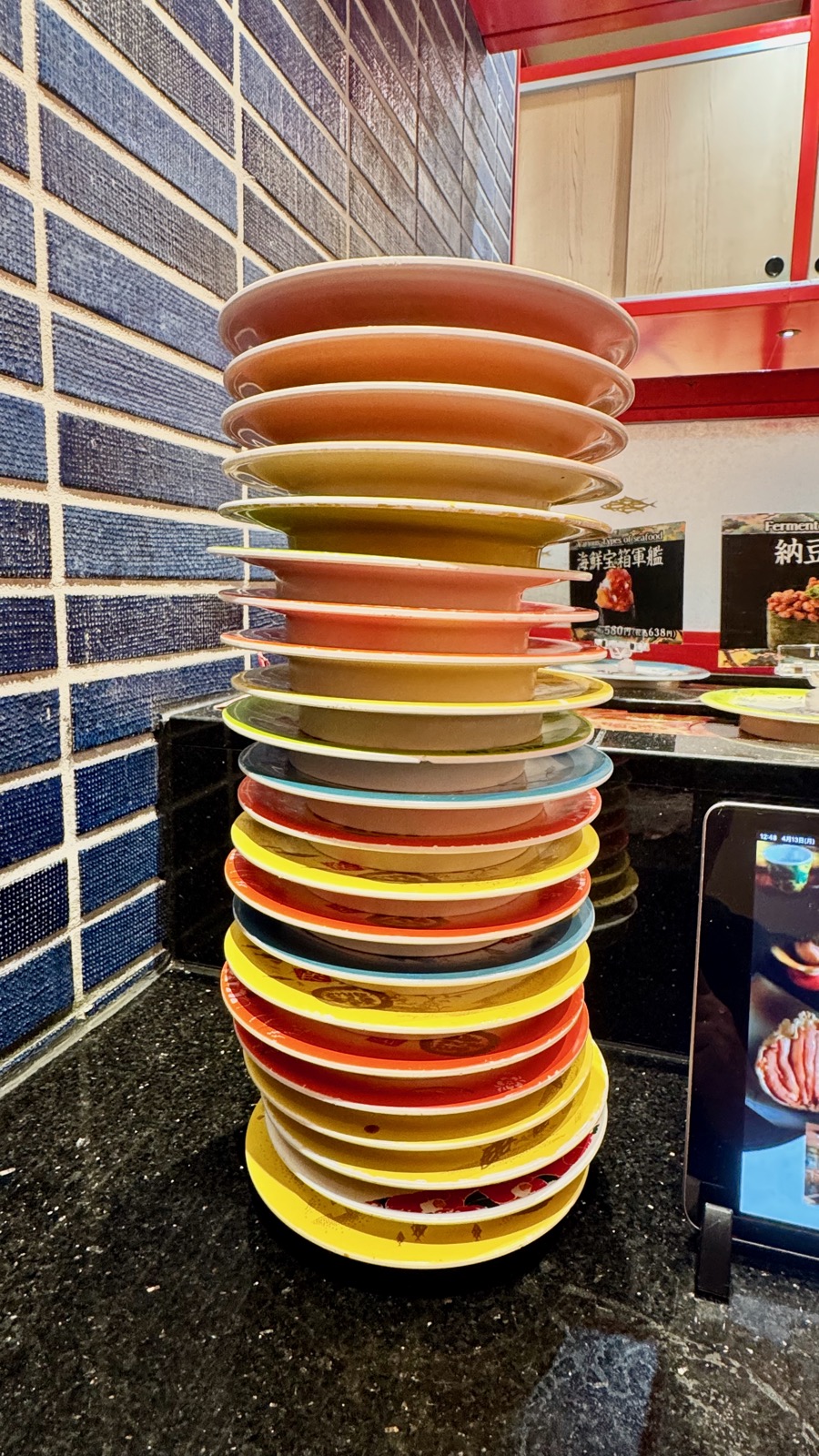 The damage &mdash; towering stack of sushi plates at Maimon Sushi