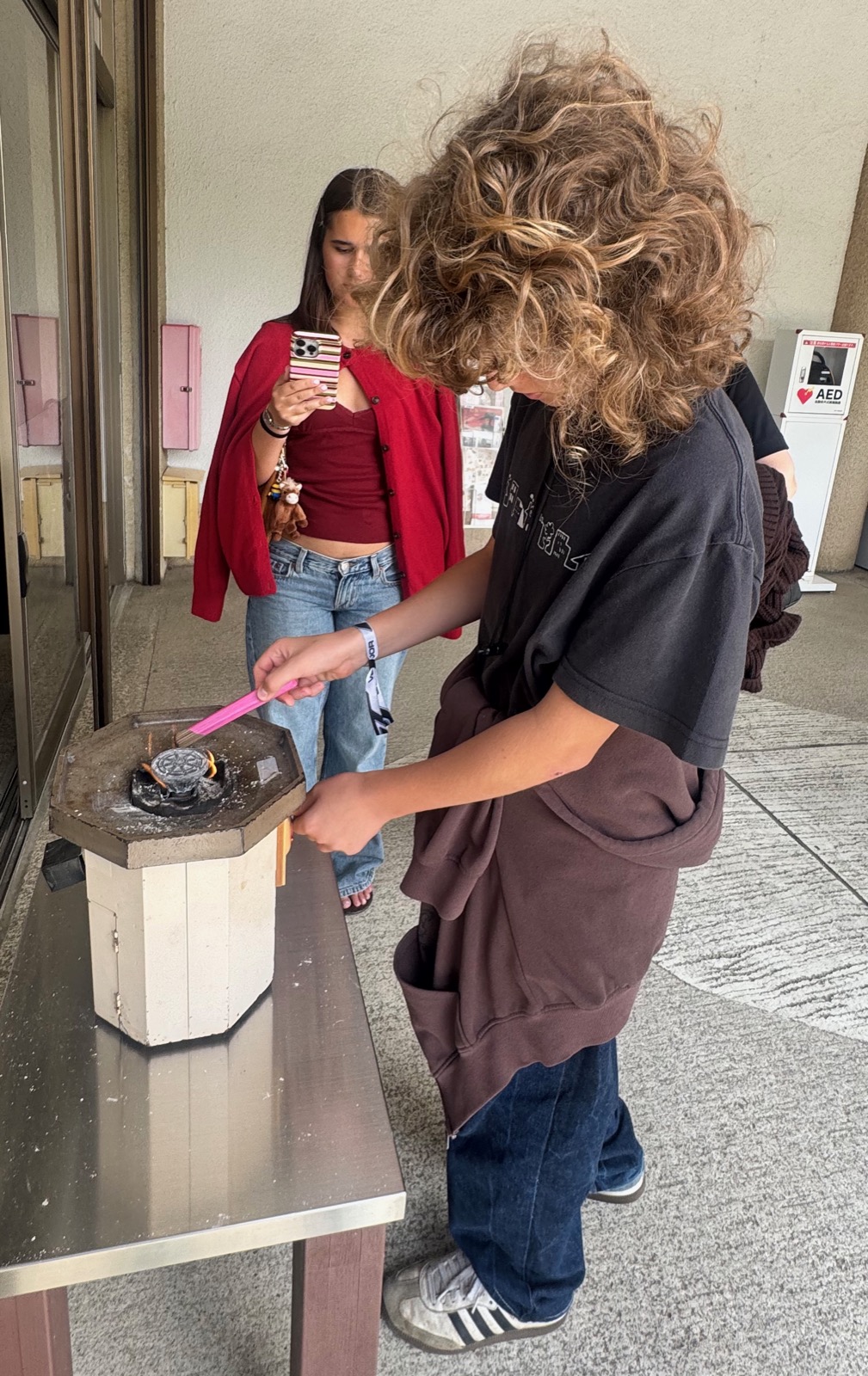 Luca and Seraphima lighting incense at Kotoku-in