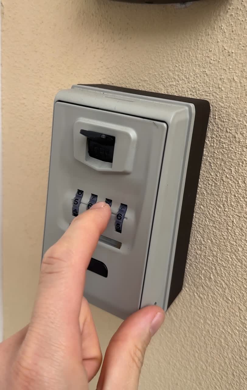 The key lockbox on the gate — code 5656