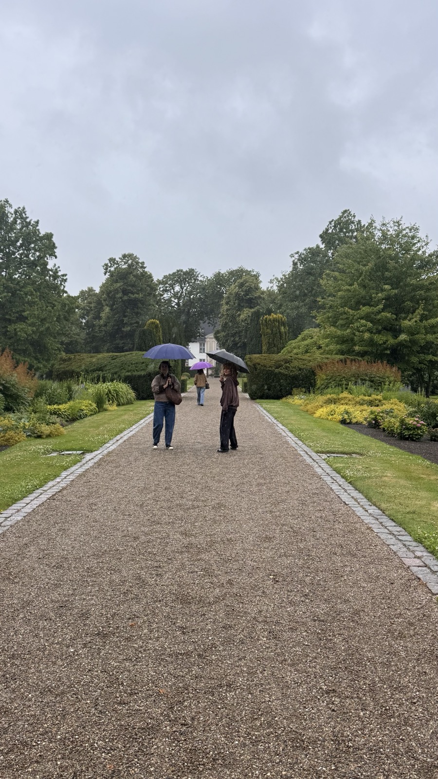The rainy allee of Schackenborg Slotshave, the royal castle garden in Møgeltønder